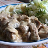 Pork fillet with mustard sauce, garlic and mushrooms