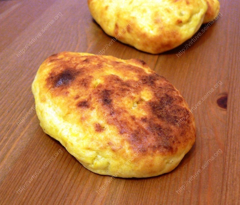 Boiled potato pancakes with cabbage filling