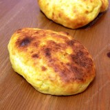 Boiled potato pancakes with cabbage filling