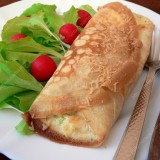 Crepes stuffed with broccoli and cheese